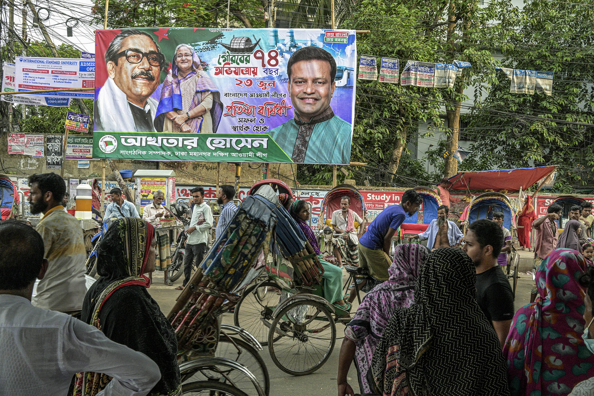 A billboard features Bangladeshi Prime Minister Sheikh Hasina (center) on the streets of Dhaka, Bangladesh, on June 14, 2023. (Atul Loke/The New York Times)