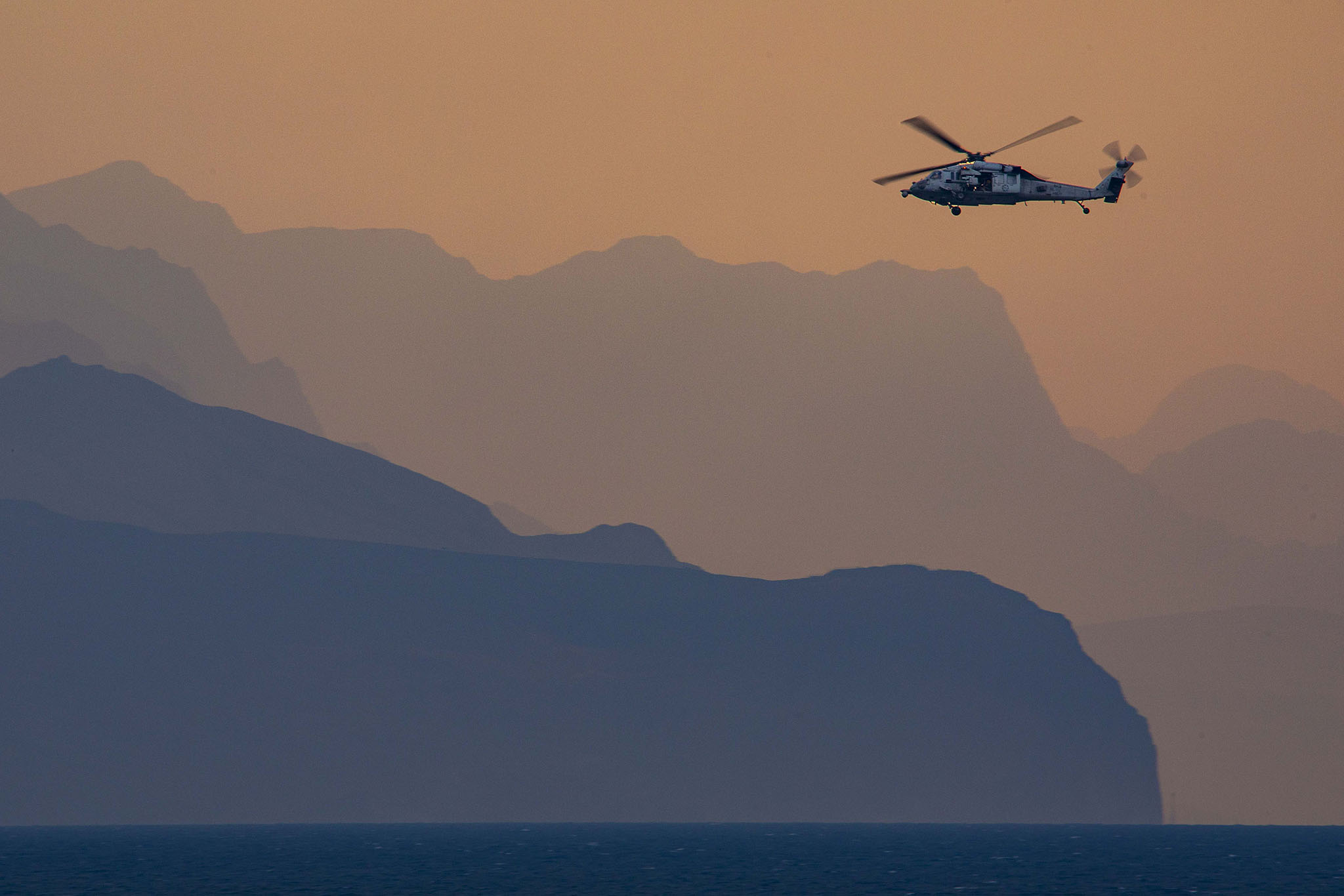 A Navy MH-60S Sea Hawk helicopter patrolled the Strait of Hormuz on Dec. 14, 2023. (Navy Petty Officer 2nd Class Keith Nowak)
