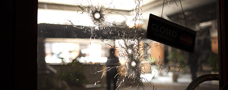 A store window riddled with bullet holes caused during a four-day siege at Westgate Mall in Nairobi, Kenya, Sept. 30, 2013. The attack, which the Islamist extremist group al-Shabab has taken credit for, left more than 60 people dead and scores more wounded. (Tyler Hicks/The New York Times)