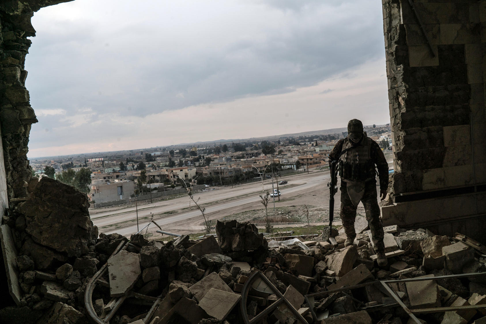 An Iraq soldier in a damaged building in Mosul in February, 2017. The overall push to free Mosul, once Iraq’s second-largest city, began in October, with local troops pushing from the east into the city’s geographically larger but more sparsely populated eastern half. In late January, they reached the banks of the Tigris River, which bisects Mosul, and declared the city’s eastern section liberated. (Ben C. Solomon/The New York Times) 