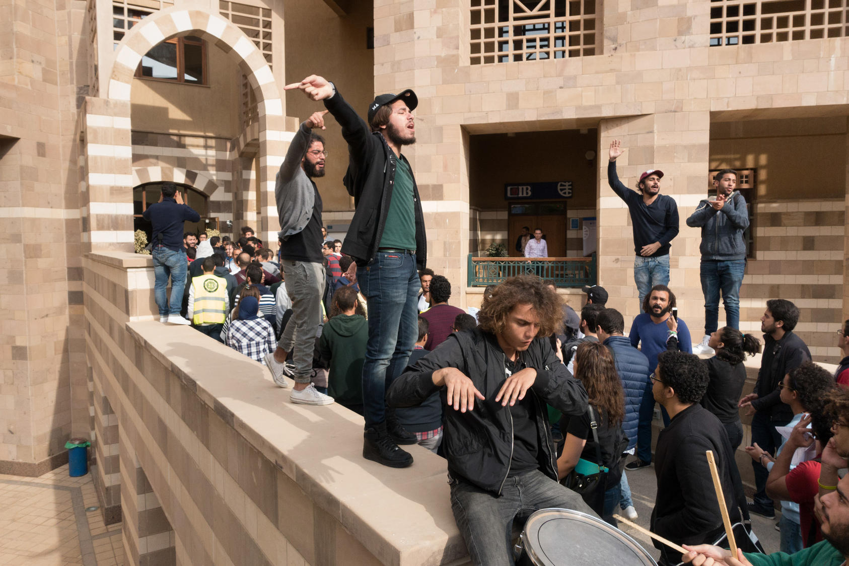 Students protest at the American University of Cairo, demanding a cap to their tuition, in Cairo, Nov. 16, 2016. The demonstrations are the largest and longest-running at the elite institution in years. “When the economic crisis hits the elite, it means the suffering is all over the place,” said Malak Rostom, vice president of the student union. (David Degner/The New York Times) 