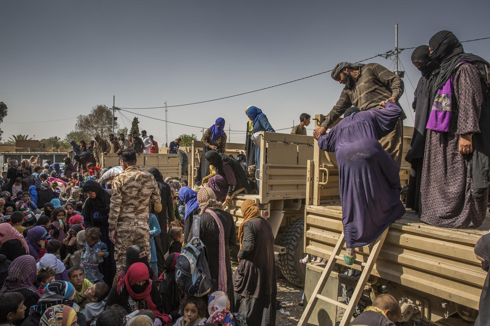 Displaced people arrive at a security screening center in Kirkuk, Iraq, Oct. 1, 2017. Photo Courtesy of The New York Times/Ivor Prickett