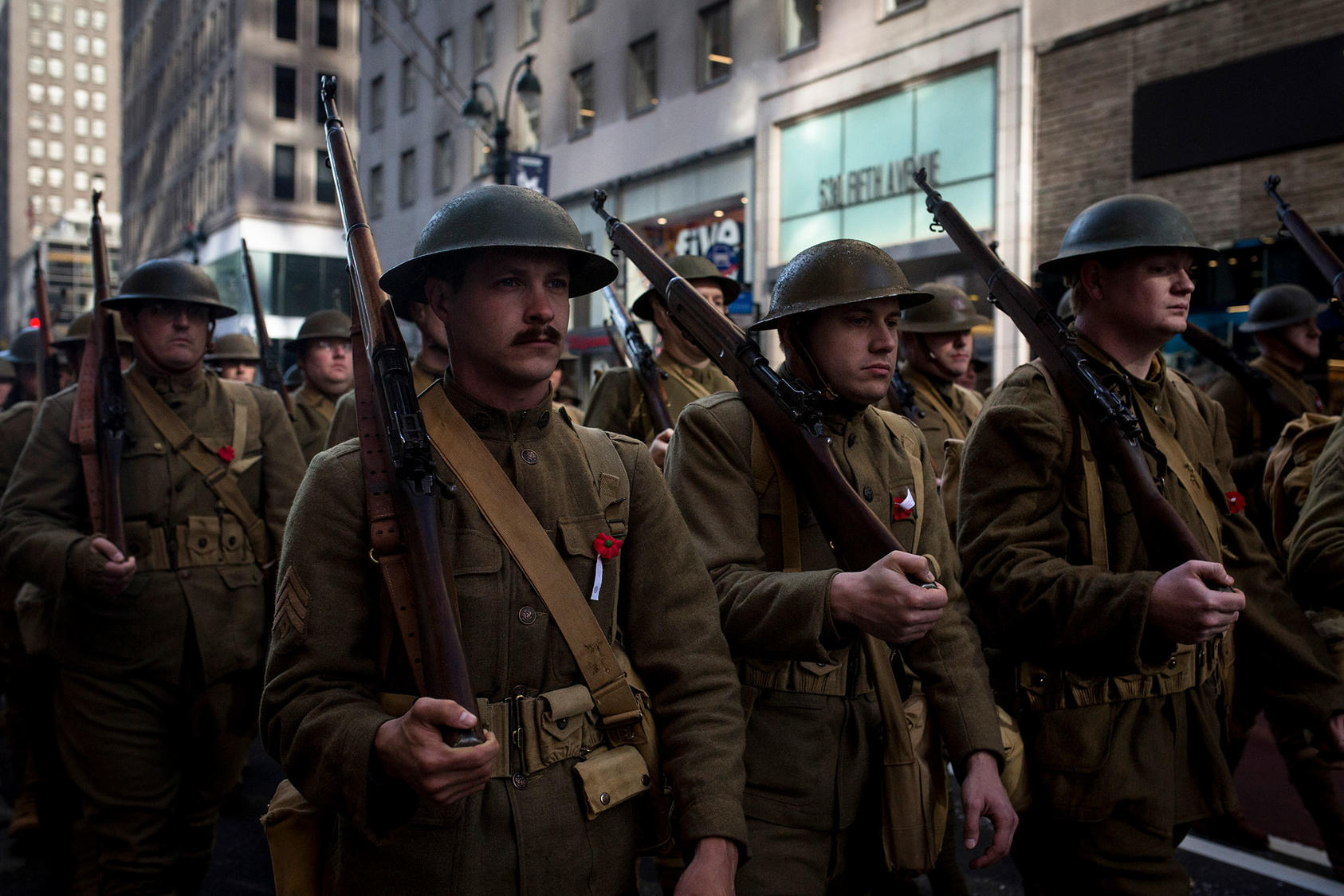Re-enactors wear World War I era U.S. Army uniforms during the Veterans Day Parade in New York, Nov. 11, 2018. This year marks the 100th since the end of the war. (Dave Sanders/The New York Times)