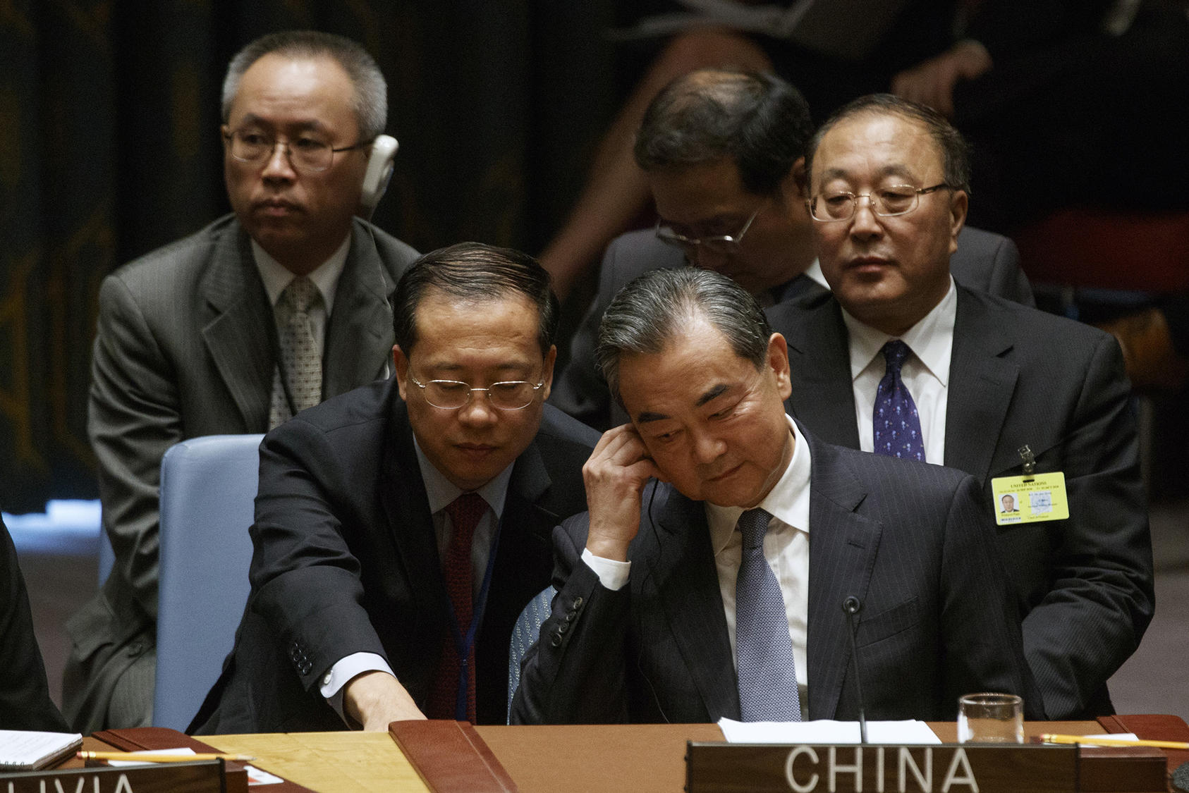 China’s foreign affairs minister, Wang Yi, seated at front right, confers with an aide at a United Nations Security Council meeting at U.N. headquarters in New York on Wednesday, Sept. 26, 2018. (Tom Brenner/The New York Times)