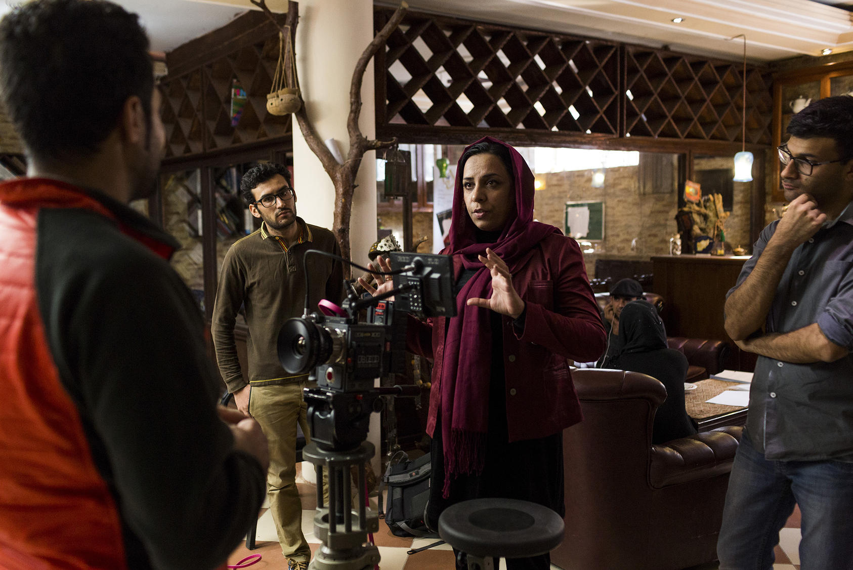 Roya Sadat, center, at a test shoot for a TV drama she directed in Kabul, Oct. 18, 2017. Sadat sold her apartment, car and jewelry to make a movie on women’s rights. It’s Afghanistan’s selection for the Oscars now. (Jim Huylebroek/The New York Times)