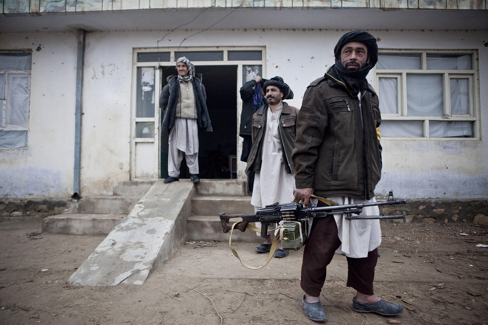 Men from one of Afghanistan’s many militia forces carry a machine gun on patrol in Balkh province. Years of war have made guns and combativeness more central to Afghan men’s ideas of masculinity—a hurdle to peacemaking. (Bryan Denton/The New York Times)