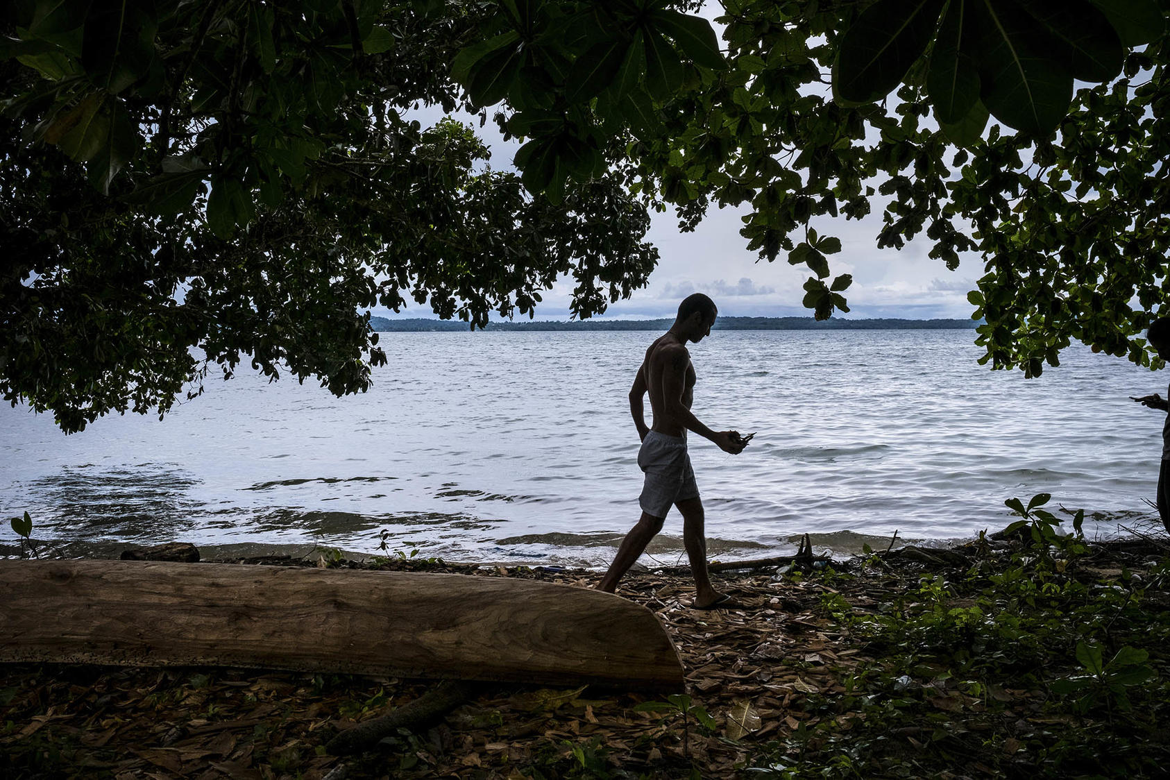 An asylum seeker on Manus Island, Papua New Guinea, Nov. 19, 2016. The situation of stranded refugees and migrants in processing centers on Manus Island brings additional stresses to local conditions. (Ashley Gilbertson/The New York Times)