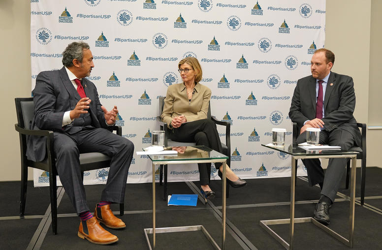 Representatives Ami Bera (D-CA), left, and Lee Zeldin (R-NY), right, talk with U.S. Institute of Peace President Nancy Lindborg, May 10, 2019.