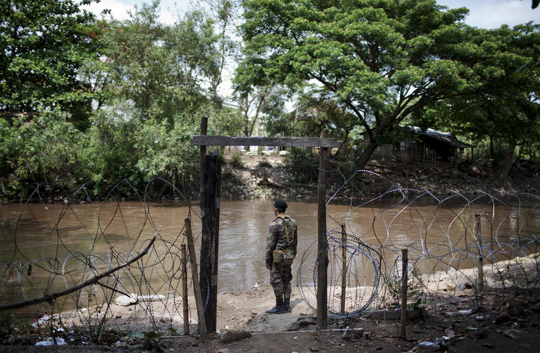 A soldier at a military checkpoint along the Sai River, which borders Myanmar, in Mae Sai, Thailand, May 9, 2012. (Giulio Di Sturco/International Herald Tribune)