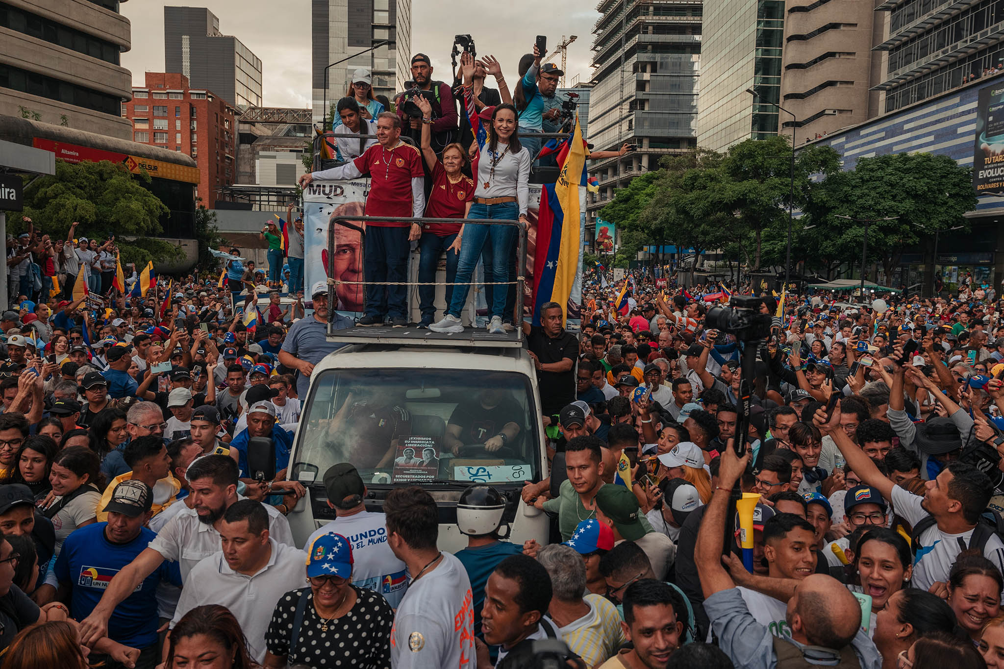 Opposition leaders María Corina Machado, in white, and Edmundo González, in red, during a rally for González’s presidential campaign, in Caracas, Venezuela, July 4, 2024. (Adriana Loureiro Fernandez/The New York Times)
