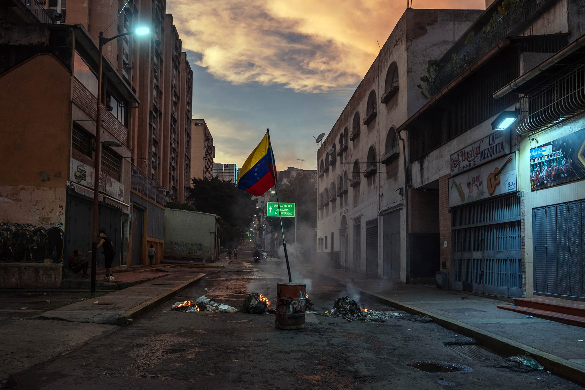 Fires set by antigovernment protesters burn in Caracas, Venezuela. July 29, 2024. (Adriana Loureiro Fernandez/The New York Times)
