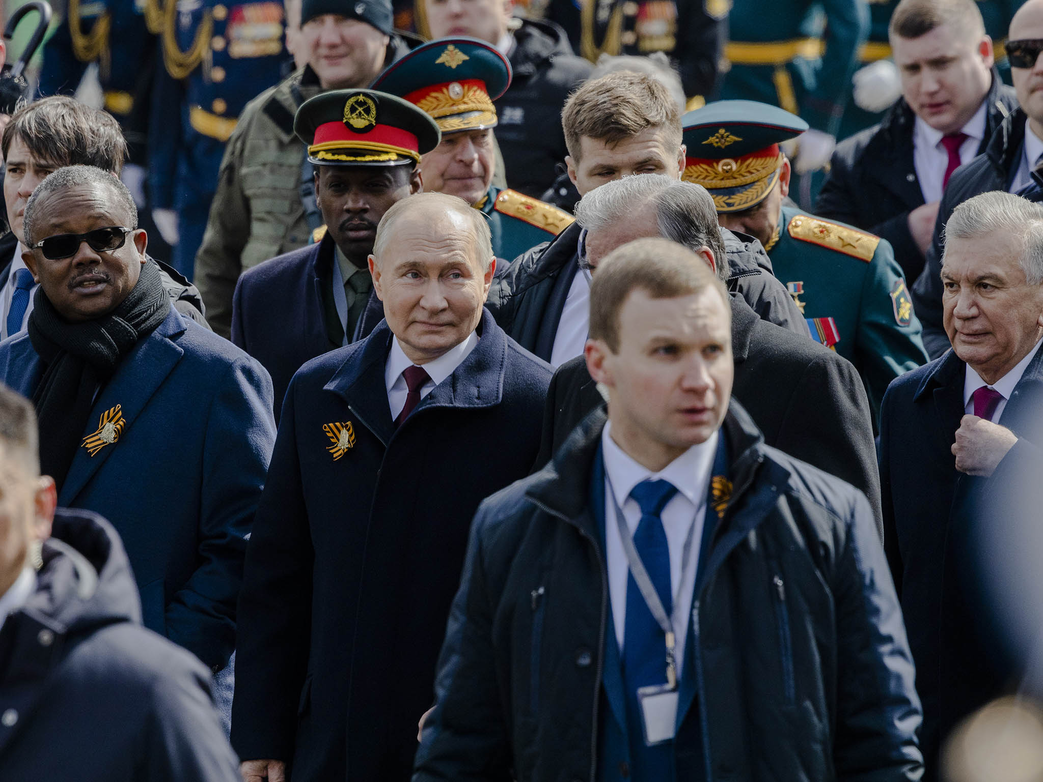 Russian President Vladimir Putin, center, leaves a Moscow parade in May. His August prisoner exchange with Western countries raises questions about whether and how other nations might negotiate with him. (Nanna Heitmann/The New York Times)