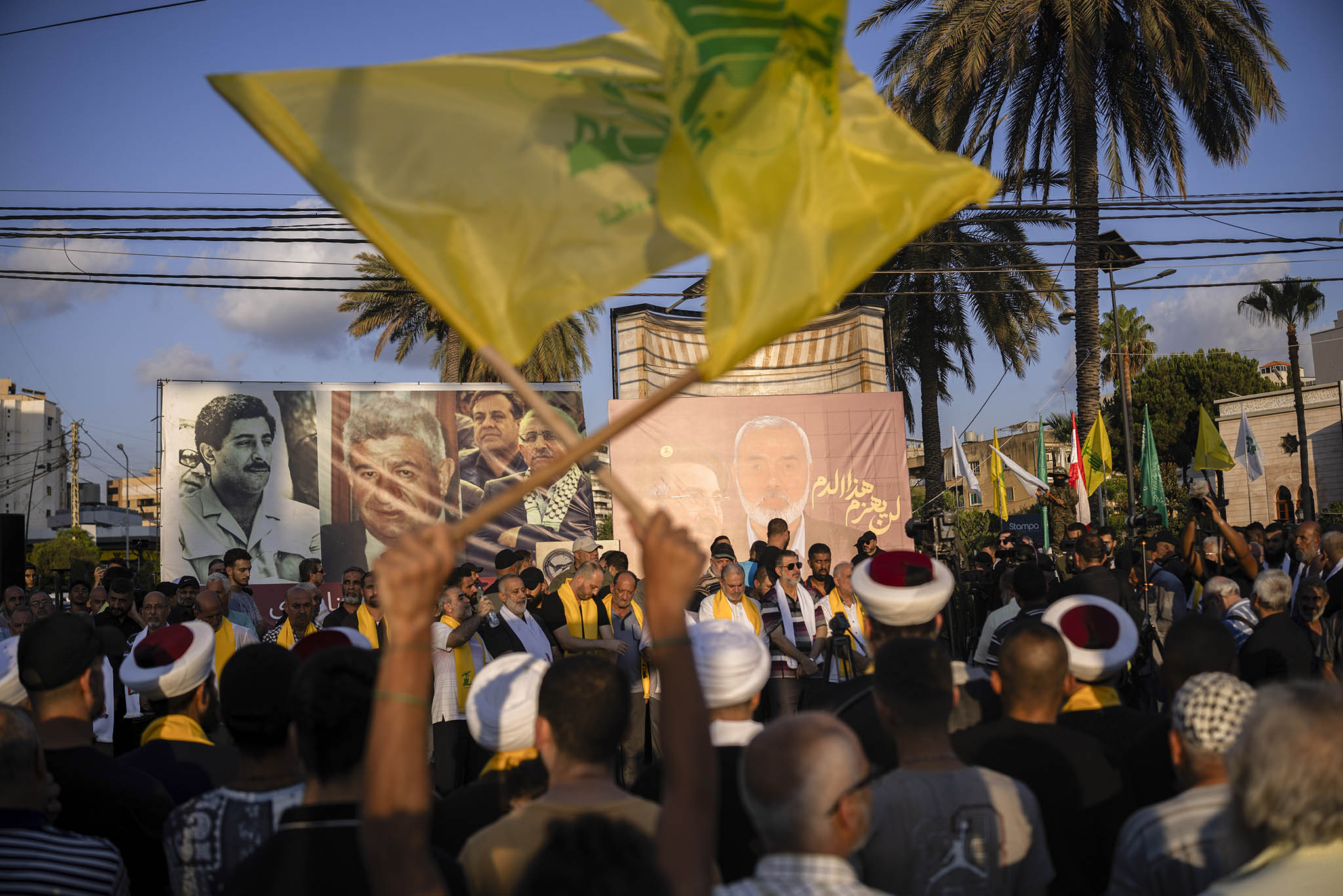 Hamas and Hezbollah supporters pay tribute to two killed leaders, the Hamas leader, Ismail Haniyeh, and a top Hezbollah commander, Fuad Shukr, in Saida, Lebanon, on Aug. 2, 2024. (Diego Ibarra Sanchez/The New York Times)