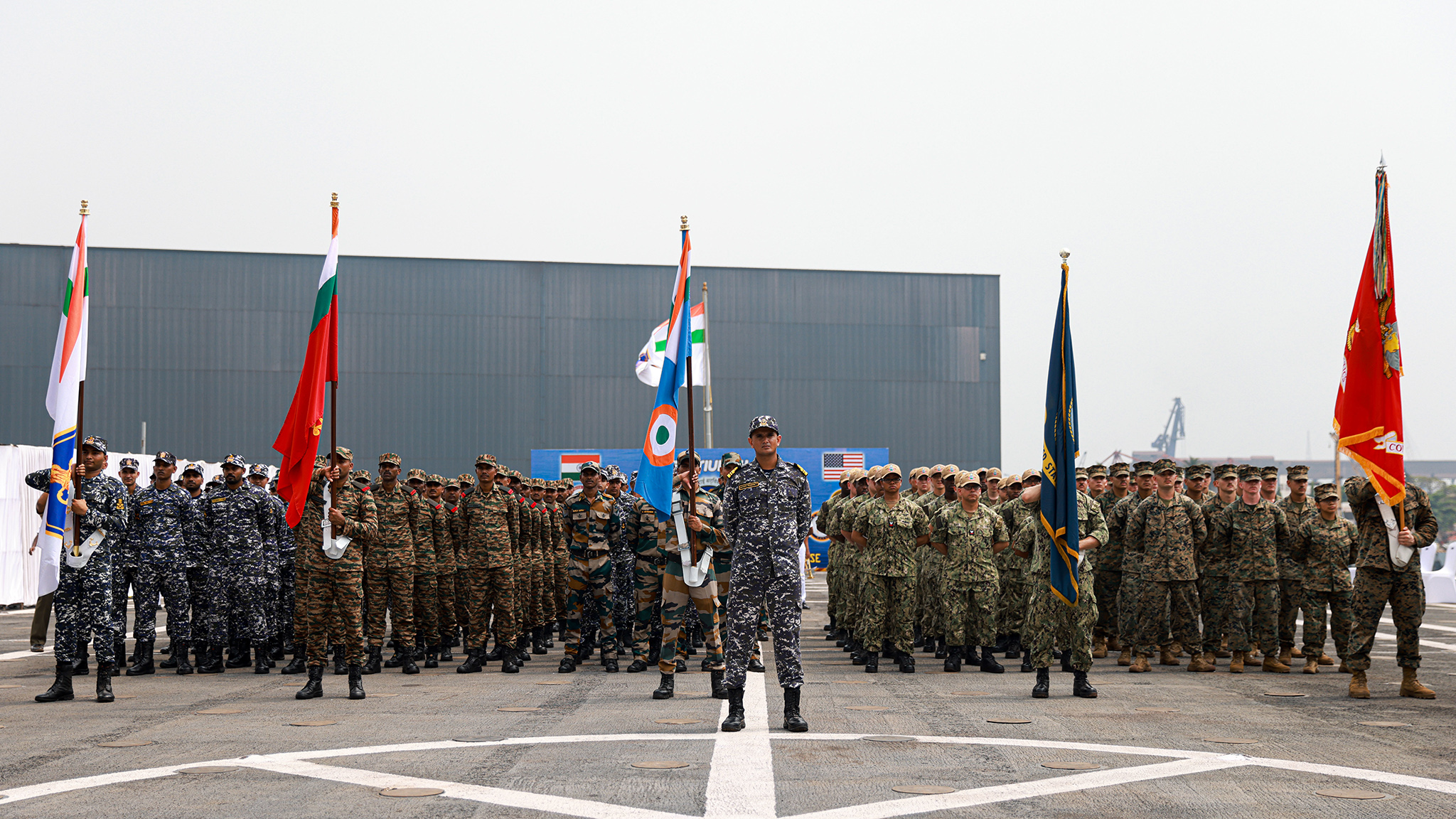 Indian service members and U.S. marines and sailors stand together in formation during the opening ceremony of Exercise Tiger TRIUMPH in Visakhapatnam, India, March 19, 2024. (U.S. Marine Corps photo by Cpl. Aidan Hekker)