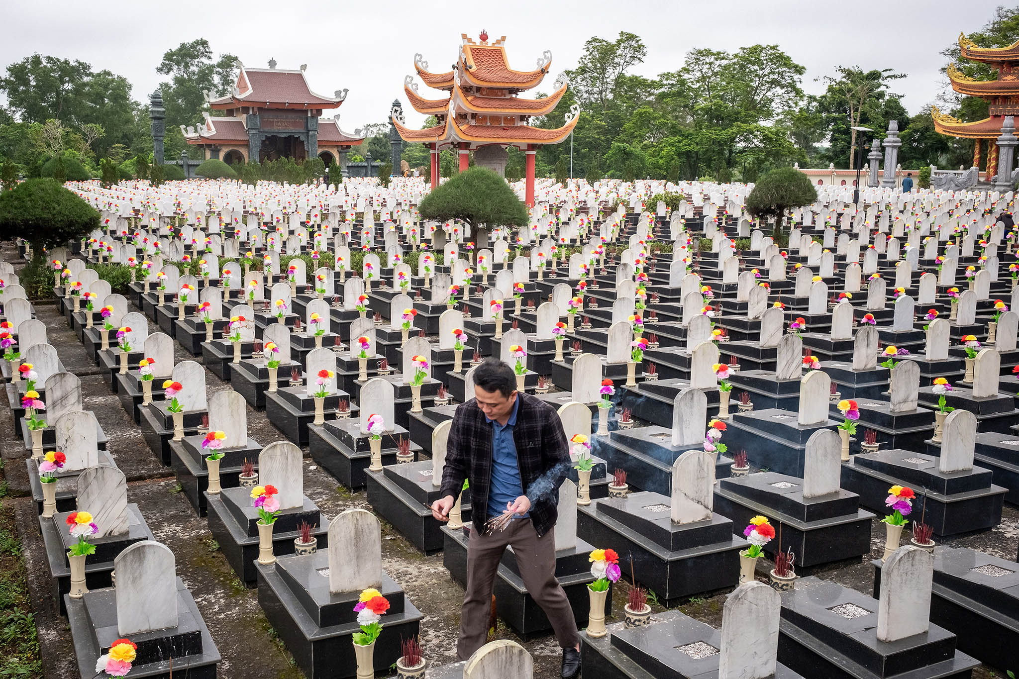 A visitor at the Truong Son National Military Cemetery, a memorial to the North Vietnamese soldiers who died during the Vietnam War, in Quang Tri province, Vietnam. February 29, 2024. (Linh Pham/The New York Times)