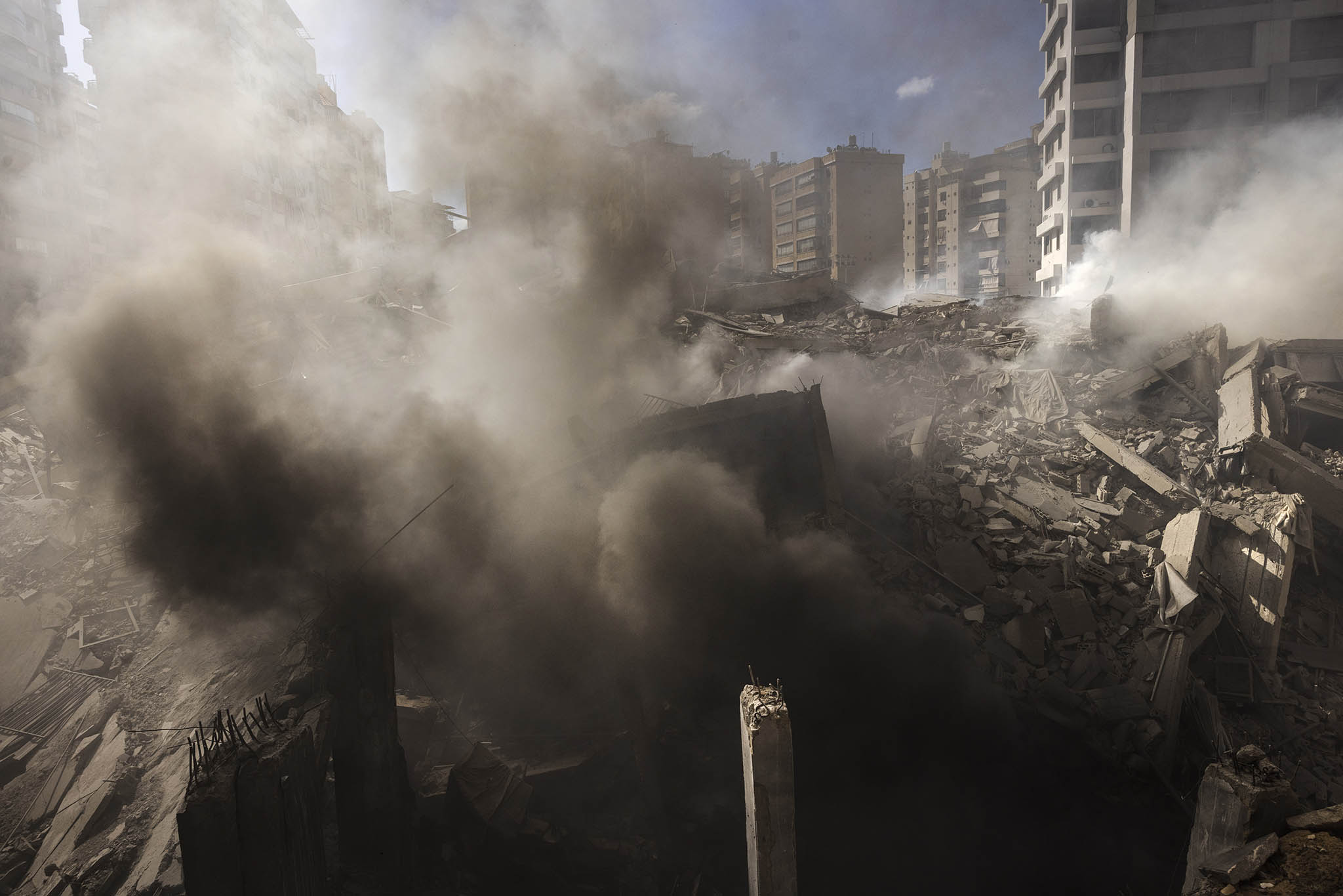 Smoke rises from the wreckage after a week of Israeli airstrikes in Dahiya, the predominantly Shia southern suburbs of Beirut, on Wednesday, Oct. 2, 2024. (David Guttenfelder/The New York Times)