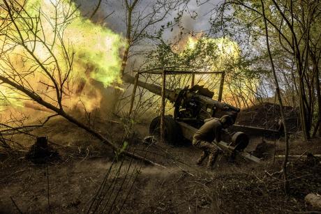 Ukrainian gunners fire at a Russian position in May. Ukraine is seeking international support for its 19-month-old peace plan based on international law and demands for Russia’s withdrawal from Ukraine. (Finbarr O'Reilly /The New York Times)