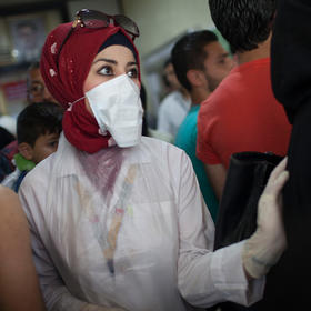 Medics receive casualties at the Al Razi hospital in government-controlled Aleppo, Syria, April 28, 2016. (Declan Walsh/ The New York Times)