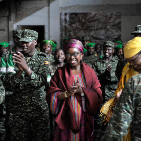 AU Special Envoy for Women, Peace and Security Bineta Diop dances with African Union soldiers at Mogadishu Stadium in Somalia on November 27, 2014 (AMISOM Public Information/Flickr)