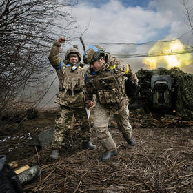 Ukrainian soldiers with the 31st Separate Mechanized Brigade fire a 122-millimeter howitzer D-30 at a Russian target in the Donetsk region of eastern Ukraine, Feb. 20, 2024. (Tyler Hicks/The New York Times)