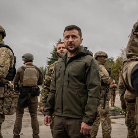 President Volodymyr Zelenskyy of Ukraine makes an unannounced visit to a flag raising ceremony in the main square of the recaptured city of Izium, on Wednesday, Sept. 14, 2022. (Nicole Tung/The New York Times)