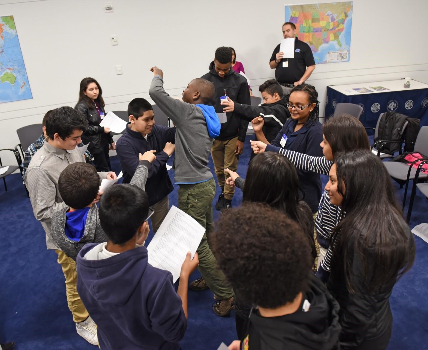 Students observe each other’s work in an activity on nonviolence.