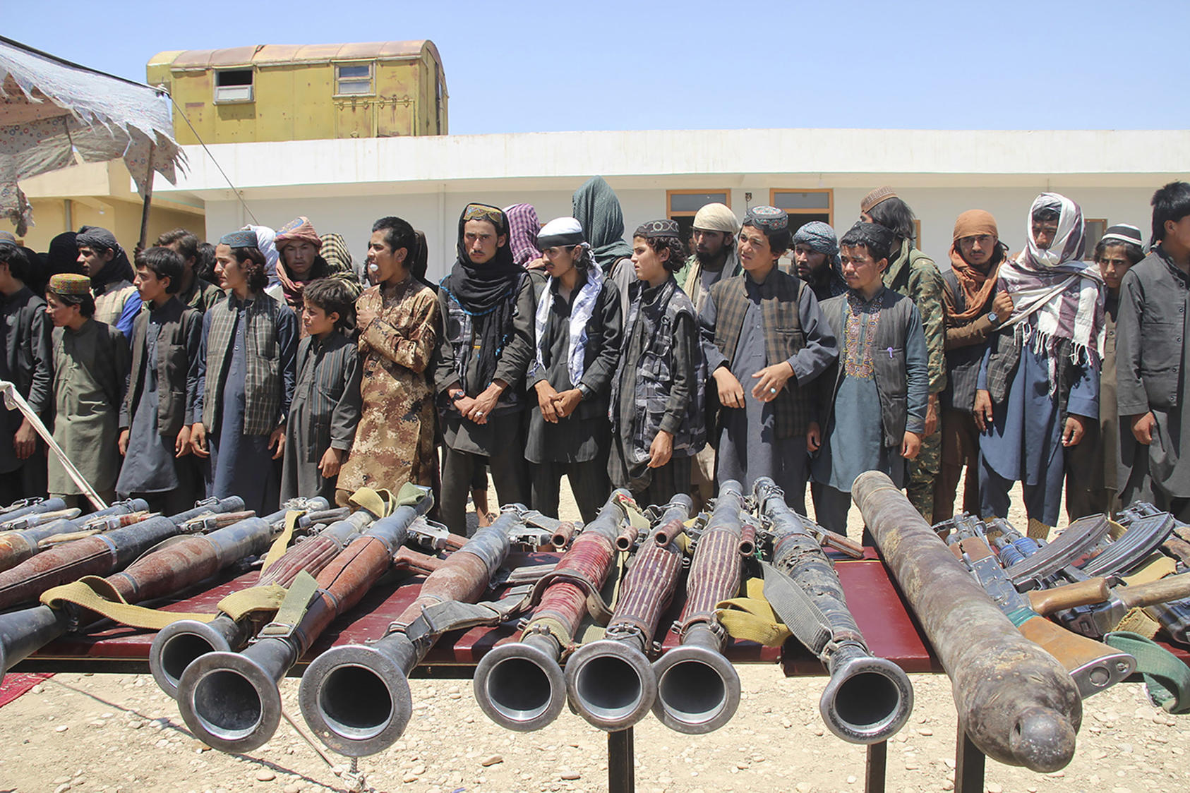 ISKP fighters turn themselves in to the Afghan government in Sheberghan on August 1, 2018, to avoid capture by the Taliban. (Najim Rahim/New York Times)