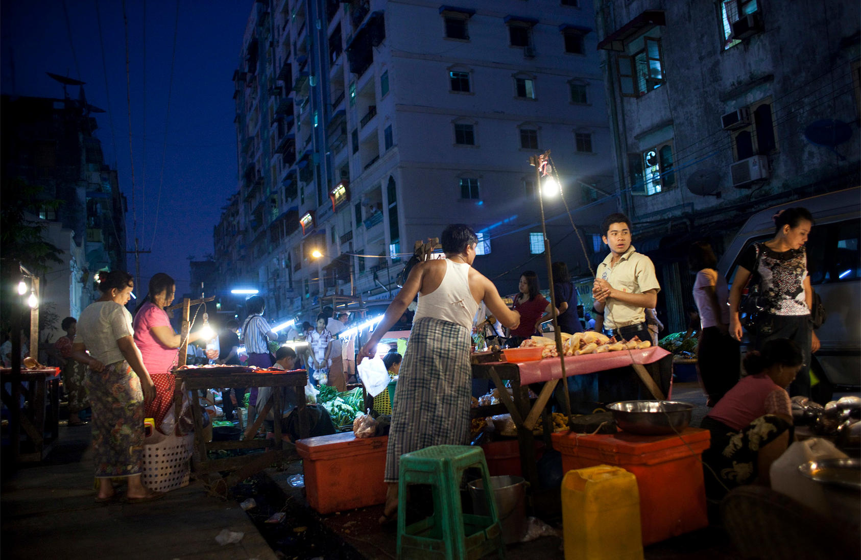 A vendor sells chicken at a street market in Yangon, Myanmar, Nov. 28, 2011. (International Herald Tribune)