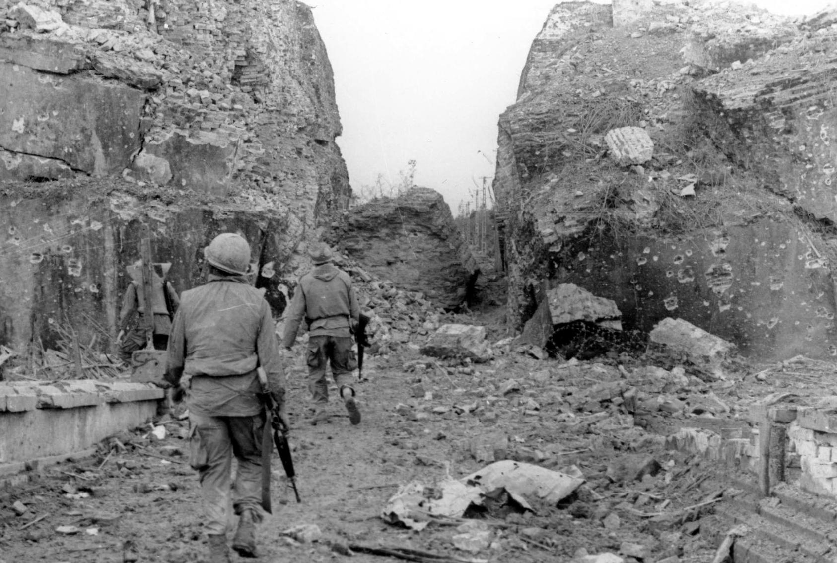 U.S. troops patrol along the shattered ancient walls of the Vietnamese city of Huế during the North Vietnamese 1968 Tet Offensive. That campaign was the bloodiest phase of two decades of war in Vietnam. (U.S. Army)