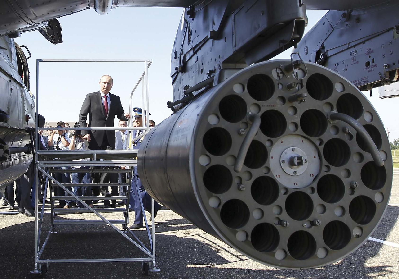 Russian President Vladimir Putin inspects a ground-attack helicopter at a base in Korenovsk, in western Russia, June 14, 2012. Russia has supplied advanced defensive missile systems to Syria. (Mikhail Klimentyev/Pool via The New York Times)