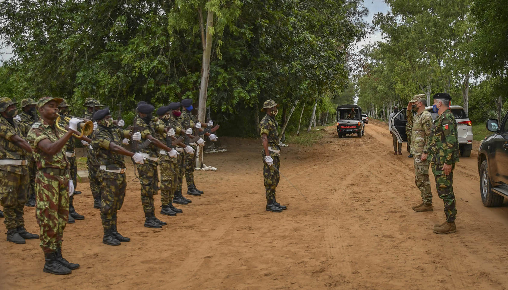 U.S. AFRICOM commander General Stephen Townsend reviews a Mozambican Armed Defense Forces formation alongside Portuguese Brig. Gen. Nuno Lemos Pires, mission force commander for the European Union Training Mission in Mozambique, Nov. 18, 2021. (Patrick Loch/U.S. Africa Command)