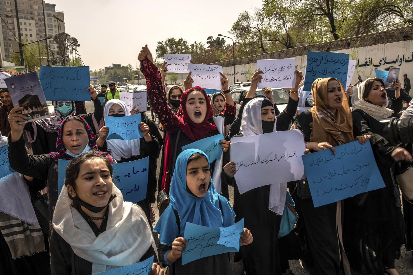 Women protest the Taliban’s decision to cancel the return of high school-aged girls to the classroom, in Kabul, Afghanistan, on March 26, 2022. (Bryan Denton/The New York Times)