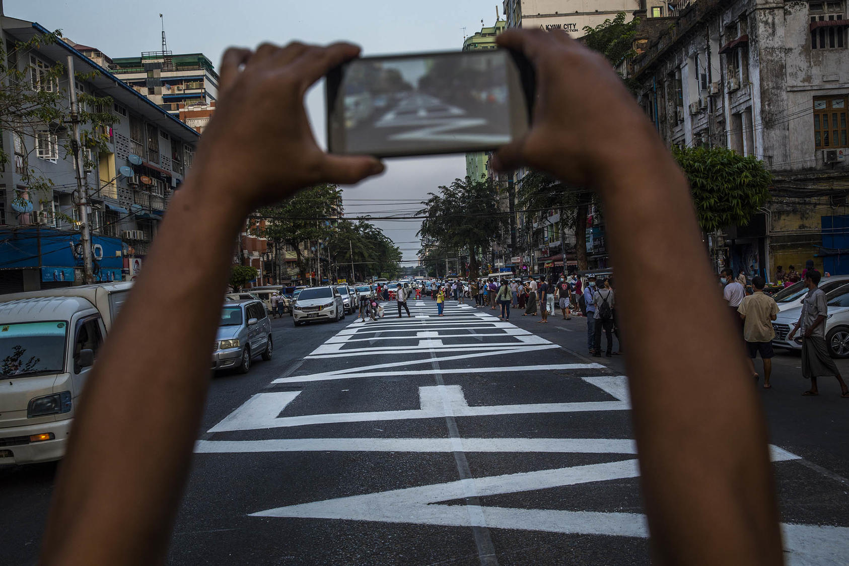 "We need democracy" written on a street to protest the coup that ousted the civilian government in Yangon, Myanmar. February 20, 2021. (The New York Times)