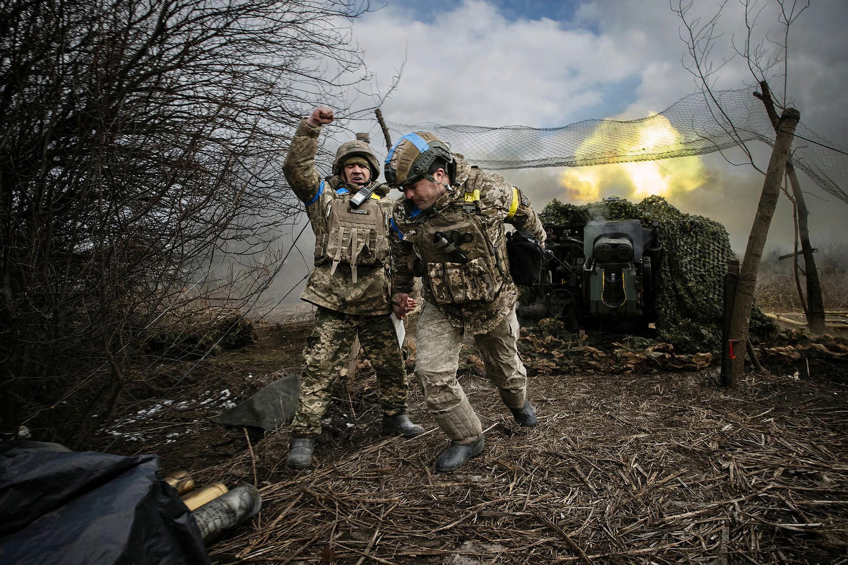 Ukrainian soldiers with the 31st Separate Mechanized Brigade fire a 122-millimeter howitzer D-30 at a Russian target in the Donetsk region of eastern Ukraine, Feb. 20, 2024. (Tyler Hicks/The New York Times)