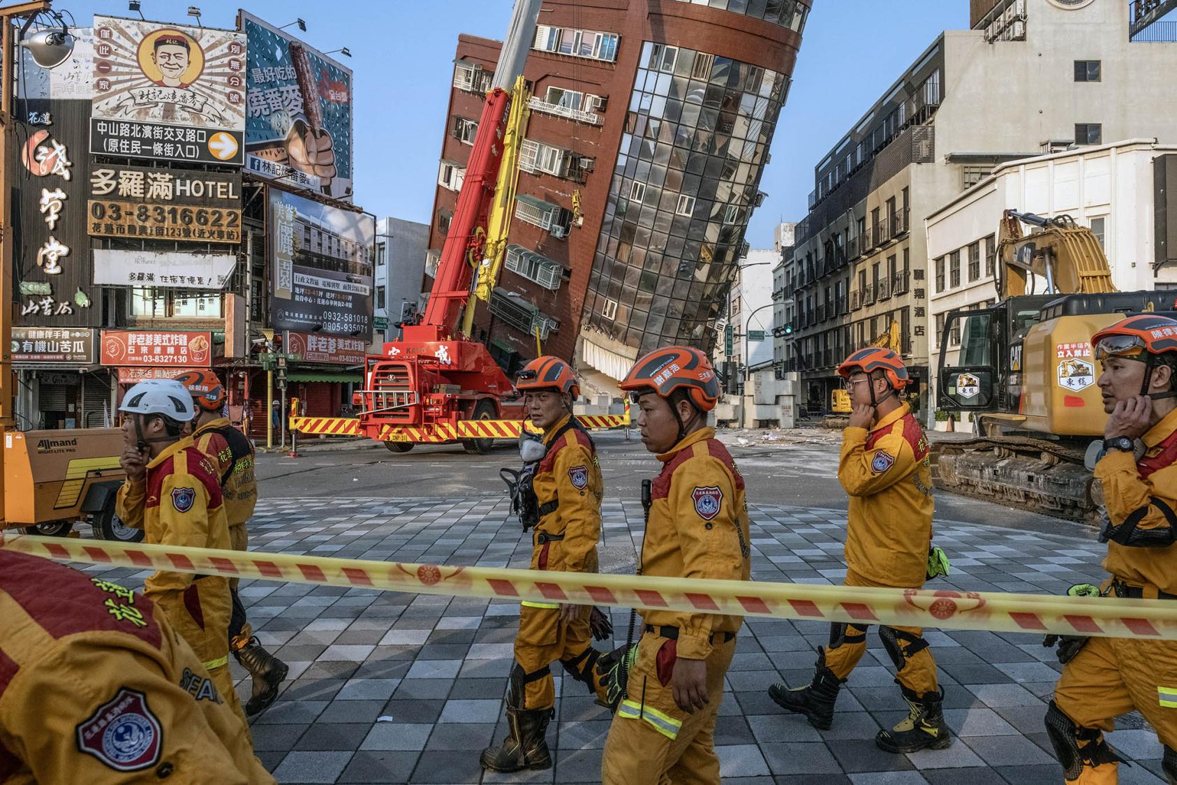 A search and rescue team prepares to enter a leaning building following a magnitude-7.4 earthquake in Hualien, Taiwan, on Wednesday, April 3, 2024. (Lam Yik Fei/The New York Times)