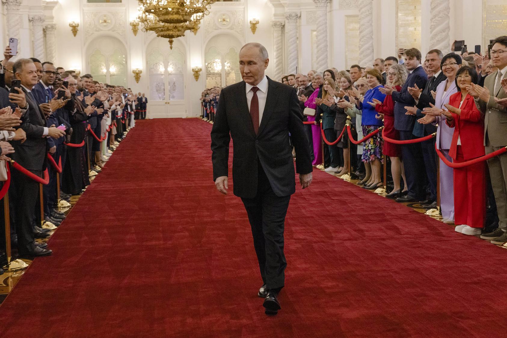 Russian President Vladimir Putin strides to his inauguration for a fifth term in office this month. His replacement of his defense minister days later re-emphasizes his readiness for a long war on Ukraine. (Nanna Heitmann/The New York Times)