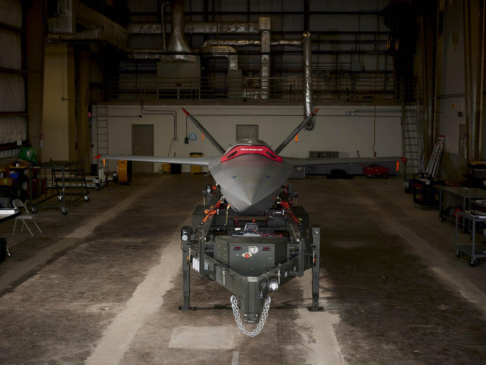 The Kratos XQ-58 unmanned combat aerial vehicle at Eglin Air Force Base, July 2023. The drone uses artificial intelligence and has the capability to carry weapons, although it has not yet been used in combat. (Edmund D. Fountain/The New York Times)