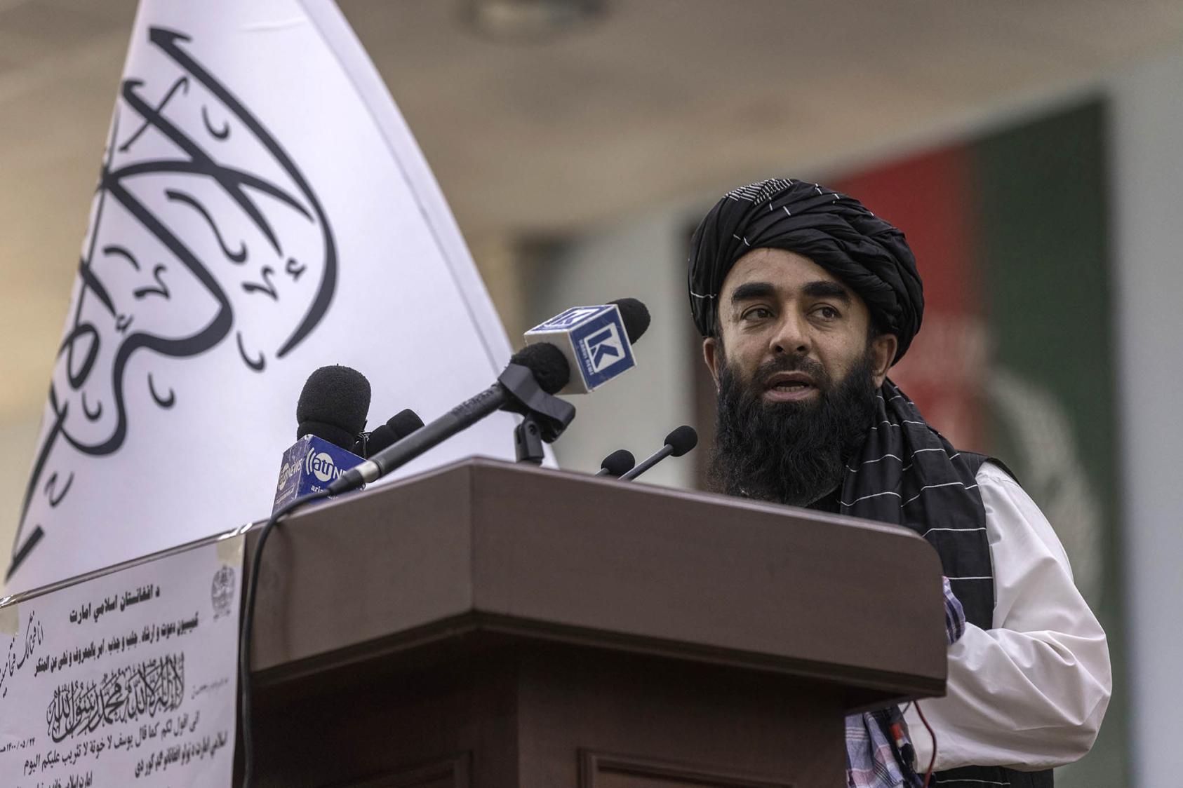 Zabihullah Mujahid, the Taliban’s chief spokesman who led its delegation at the Doha 3 meeting, speaks before hundreds of religious leaders at the Loya Jirga Hall in Kabul, Afghanistan, on Monday, Aug. 23, 2021. (Victor J. Blue/The New York Times)