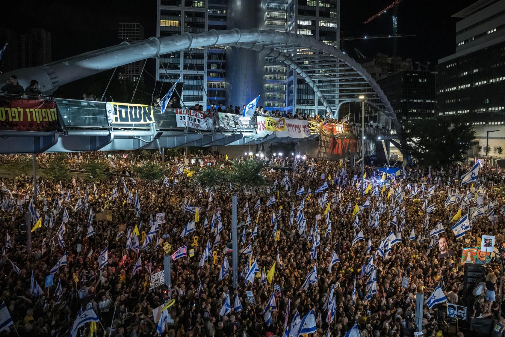 Thousands of protesters march in front of the Israeli military headquarters in Tel Aviv on Sunday night, Sept. 1, 2024. (Sergey Ponomarev/The New York Times)