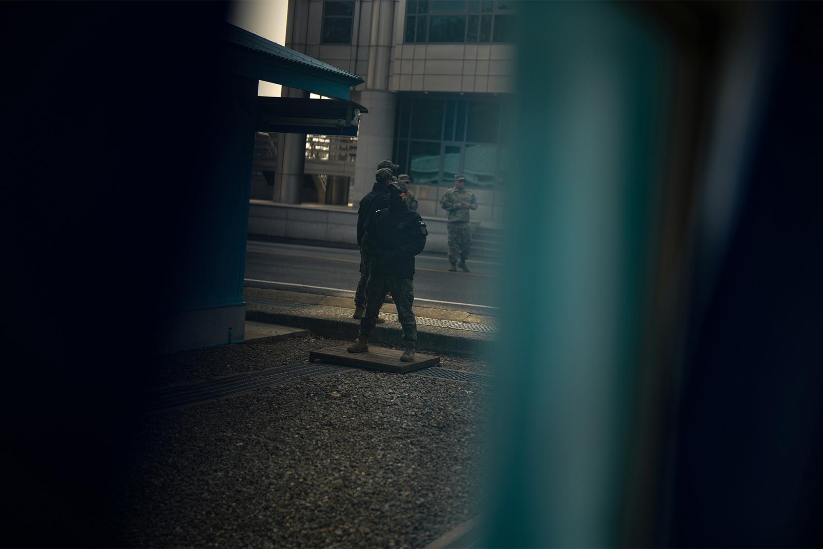 Soldiers are seen near the military demarcation line at Panmunjom, in the Demilitarized Zone between North and South Korea, Feb. 7, 2023. (Chang W. Lee/The New York Times)