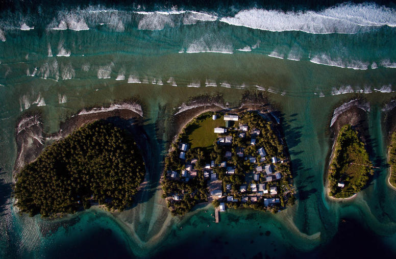 Homes on Ejit, an islet in the Majuro Atoll, Marshall Islands, pictured on Oct. 29, 2015, are under threat from rising seas. (Josh Haner/The New York Times)