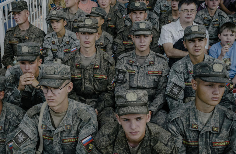 Russian conscript soldiers watch a tank biathlon at the annual Army International Games near Moscow, Aug. 21, 2022. (Nanna Heitmann/The New York Times)