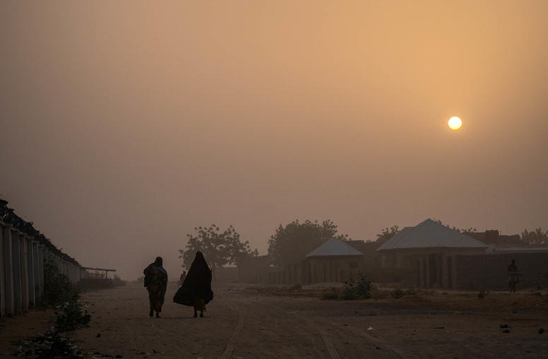 People walk through a refugee camp in Maiduguri, Nigeria, Feb. 17, 2017. (Ashley Gilbertson/The New York Times)