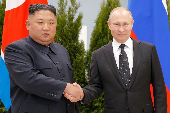 Russian President Vladimir Putin, right, and North Korea's leader, Kim Jong Un, shake hands as they stand for photos before talks in Vladivostok, Russia, April 25, 2019. (Alexander Zemlianichenko/Pool via The New York Times)