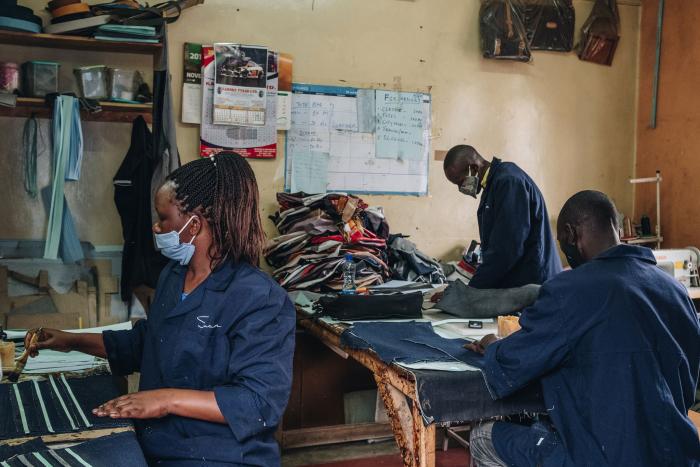 Workers at Suave Kenya, which transforms secondhand clothes into tote bags, backpacks and wallets, Nairobi, Kenya, June 16, 2020 (Khadija Farah/The New York Times)